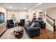A cozy living room featuring comfortable seating, stylish decor, and a staircase at 3472 Harvard Pl, Broomfield, CO 80023