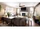 Inviting living room featuring a fireplace, comfortable seating, and a ceiling fan, creating a cozy atmosphere for relaxation at 3472 Harvard Pl, Broomfield, CO 80023