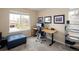 Functional home office space with a desk, computer, and natural light from a large window at 3472 Harvard Pl, Broomfield, CO 80023