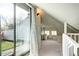 Finished attic space with carpet, dormer windows, and access to outdoor views at 2 N Pennsylvania St, Denver, CO 80203