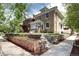 Charming brick two-story home with landscaped front yard and inviting entryway at 2 N Pennsylvania St, Denver, CO 80203