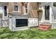 Exterior shot of a walkout basement access point, back door, and well-maintained lawn at 2 N Pennsylvania St, Denver, CO 80203