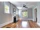 Cozy living area with hardwood floors, fireplace, and decorative diamond pane windows at 2 N Pennsylvania St, Denver, CO 80203