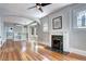 Spacious living room boasting hardwood floors, fireplace, and open archway to kitchen at 2 N Pennsylvania St, Denver, CO 80203