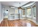 Spacious living area with hardwood floors, bay window, and view of kitchen at 2 N Pennsylvania St, Denver, CO 80203