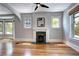 Open living area showcasing hardwood floors, fireplace, and diamond pane windows at 2 N Pennsylvania St, Denver, CO 80203