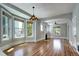 Spacious living area featuring hardwood floors, large windows, and a fireplace at 2 N Pennsylvania St, Denver, CO 80203