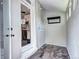 Mudroom entry area with access to the kitchen, tiled floor, and natural light at 2 N Pennsylvania St, Denver, CO 80203