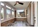 Bright sunroom with brick accents, tile floor and large windows offering street view at 2 N Pennsylvania St, Denver, CO 80203