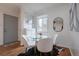 Charming dining area with a glass table, four chairs, and natural light, perfect for meals at 1235 S Zenobia St, Denver, CO 80219