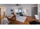 Open-concept living area features hardwood floors, modern furniture, and a welcoming atmosphere at 1235 S Zenobia St, Denver, CO 80219