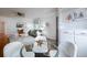 Inviting living area with hardwood floors, modern furniture, and adjacent dining space at 1235 S Zenobia St, Denver, CO 80219