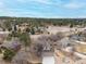 An aerial view of a suburban neighborhood with many houses and trees at 8150 Tempest Ridge Way, Parker, CO 80134