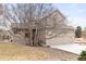 Charming two-story home with an attached two-car garage surrounded by a well-manicured yard at 8150 Tempest Ridge Way, Parker, CO 80134