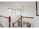 Staircase with natural light cascading from nearby window at 8150 Tempest Ridge Way, Parker, CO 80134