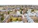 Expansive aerial view of a colorful neighborhood with well-maintained homes and mature trees at 378 Owl Dr, Louisville, CO 80027