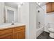 This bathroom features a combination shower and bathtub, a vanity and a toilet at 378 Owl Dr, Louisville, CO 80027