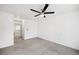This bedroom features a ceiling fan, carpeted floors and an attached hallway at 378 Owl Dr, Louisville, CO 80027