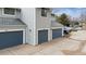 A close-up of a townhouse building featuring private garages at 378 Owl Dr, Louisville, CO 80027