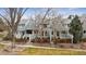 Inviting townhouse featuring a private, fenced front yard, a cozy entrance, and professional landscaping at 378 Owl Dr, Louisville, CO 80027