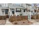 Attractive townhouse featuring a private fenced front yard, a cozy entrance, and professional landscaping at 378 Owl Dr, Louisville, CO 80027
