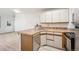 Kitchen featuring stainless steel appliances, tile countertops, and wood cabinets at 378 Owl Dr, Louisville, CO 80027