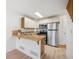 Cozy kitchen with stainless steel appliances, tile countertops, and ample cabinet space at 378 Owl Dr, Louisville, CO 80027