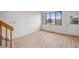 Living room featuring wood floors, a bright window, and a door to the exterior at 378 Owl Dr, Louisville, CO 80027