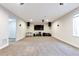 Expansive finished basement featuring carpeted floors and entertainment setup at 12217 Skywalk St, Parker, CO 80134