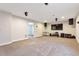 Large finished basement with carpet, speakers, and a TV at 12217 Skywalk St, Parker, CO 80134