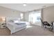 Comfortable bedroom with natural light, carpeted floors, and a spacious layout at 12217 Skywalk St, Parker, CO 80134