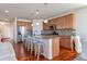 Spacious kitchen featuring a center island with seating, stainless steel appliances, and wood cabinetry at 12217 Skywalk St, Parker, CO 80134