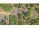 A beautiful aerial view showcases the home nestled among the trees at 24699 Us Hwy 40, Golden, CO 80401