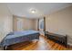 The Bedroom features natural lighting, wood floors, neutral paint and seating bench at 24699 Us Hwy 40, Golden, CO 80401