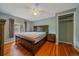The Bedroom features a ceiling fan, natural lighting, wood floors and neutral paint at 24699 Us Hwy 40, Golden, CO 80401