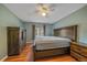 The Bedroom features a ceiling fan, natural lighting, wood floors and neutral paint at 24699 Us Hwy 40, Golden, CO 80401