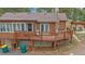 Charming log home featuring a spacious deck, stone accents, and a pergola for outdoor relaxation at 24699 Us Hwy 40, Golden, CO 80401