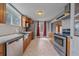 An open kitchen features granite countertops, stainless steel appliances, and a breakfast nook with natural light at 24699 Us Hwy 40, Golden, CO 80401