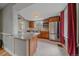 A kitchen features granite countertops, stainless steel appliances, wood cabinets, and tile backsplash at 24699 Us Hwy 40, Golden, CO 80401