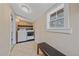 Bright laundry room with white washer, dryer, tile floor, and a window providing natural light at 24699 Us Hwy 40, Golden, CO 80401
