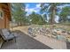 Stone patio with seating area, perfect for outdoor relaxation at 24699 Us Hwy 40, Golden, CO 80401