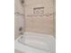 Shower featuring tiled walls, built-in niche, and modern fixtures at 24699 Us Hwy 40, Golden, CO 80401