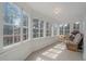 Sunny sunroom with large windows offering scenic outdoor views at 24699 Us Hwy 40, Golden, CO 80401