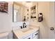 Modern bathroom with updated vanity, quartz countertop, and a frameless shower at 13791 E Lehigh Ave # A, Aurora, CO 80014