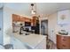 Modern kitchen with quartz countertops and stainless steel appliances at 13791 E Lehigh Ave # A, Aurora, CO 80014