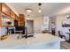 Modern kitchen with white quartz countertops and black appliances at 13791 E Lehigh Ave # A, Aurora, CO 80014