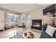 Living room with fireplace and hardwood floors at 13791 E Lehigh Ave # A, Aurora, CO 80014