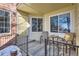 Small patio with table and chairs, partially covered at 13791 E Lehigh Ave # A, Aurora, CO 80014