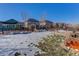 Large backyard with a snow-covered lawn and wooden fence at 4967 S Ukraine St, Aurora, CO 80015