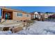 Backyard with patio, landscaping, and view of neighboring homes at 4967 S Ukraine St, Aurora, CO 80015